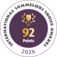 Circular badge with gold laurel wreath and the text '92 Points' in the center, '2026' below, and 'International Sommelier Association' around the edge (award badge).